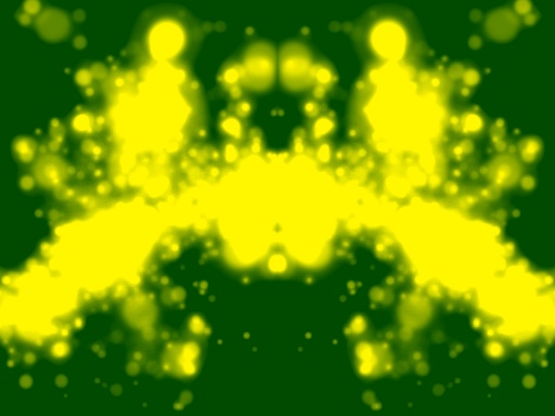 Symmetrinen keltainen musteläiskä vihreällä taustalla