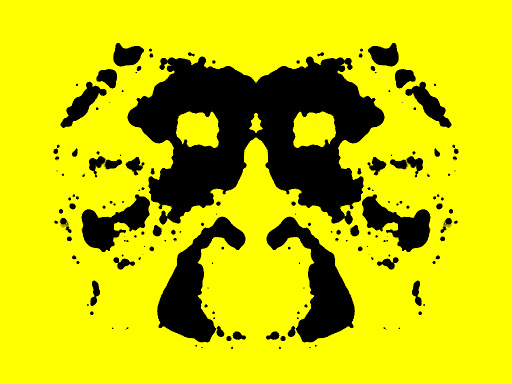 Symmetrinen musteläiskä keltaisella taustalla
