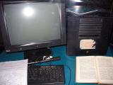 A black computer desktop with a black CRT